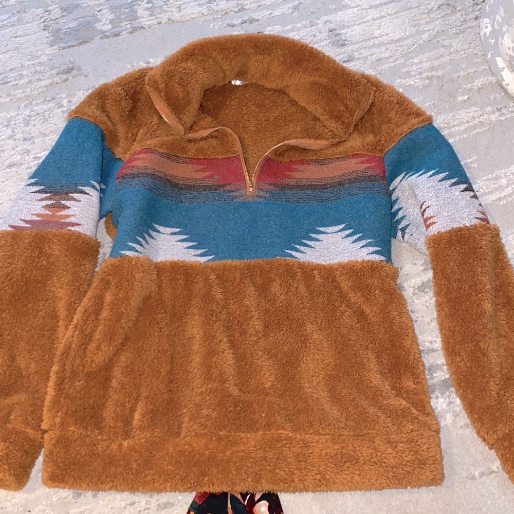 Rust color pullover with Western print on front/sleeves